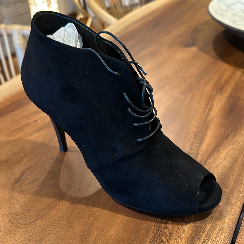 Black suede leather ankle boot that ties.  Maybe worn one time.